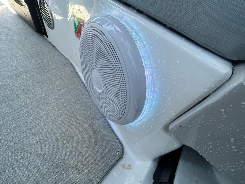 Slide: The Image of Speaker on 2022 Regal 28 Express boat, with water droplets and gray upholstery. - 38
