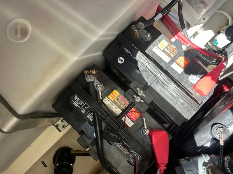 Slide: The Image of Batteries in a 2022 Regal 28 Express boat engine compartment. - 40