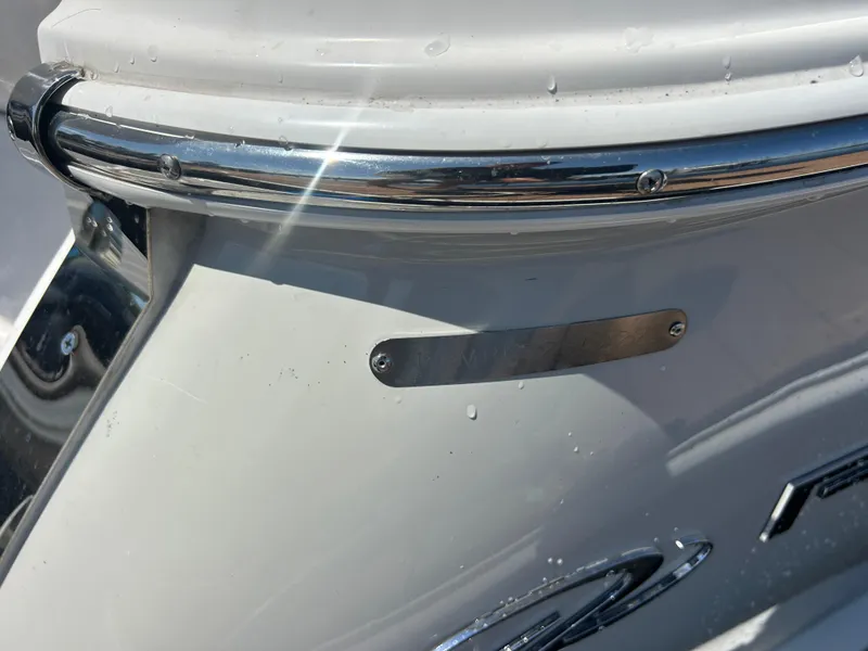 Slide: The Image of 2022 Regal 28 Express boat detail with chrome accents and sleek design. - 47