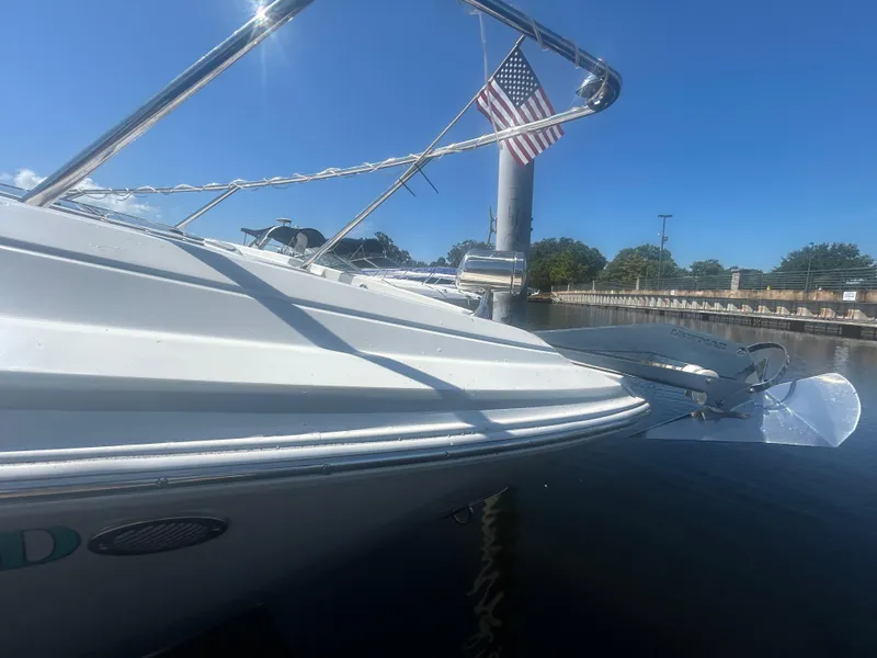 Slide: The Image of 2022 Regal 28 Express boat docked, featuring sleek design and American flag. - 9
