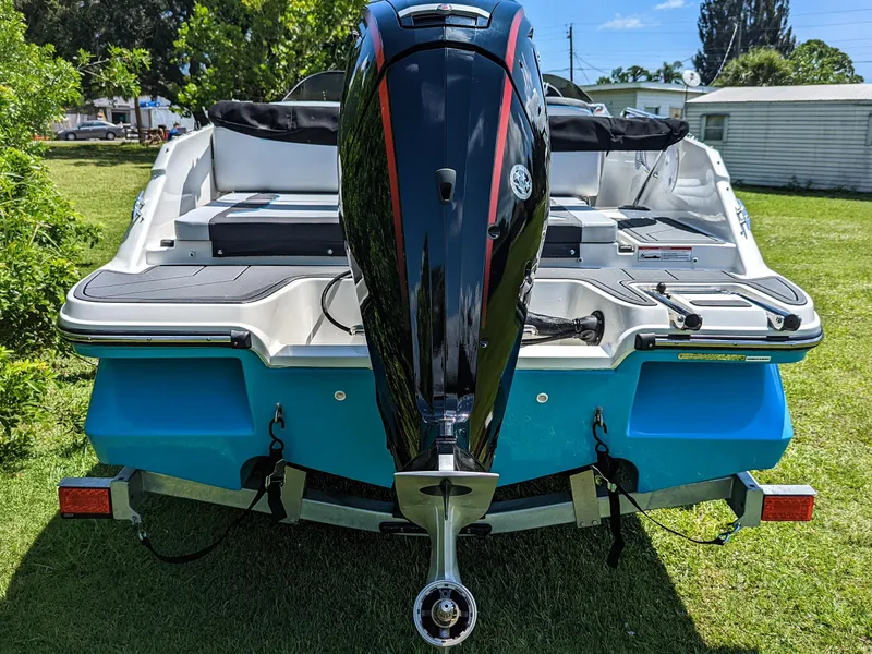 Slide: The Image of 2024 Bayliner Element M19 boat, rear view with outboard motor, on grass. - 15
