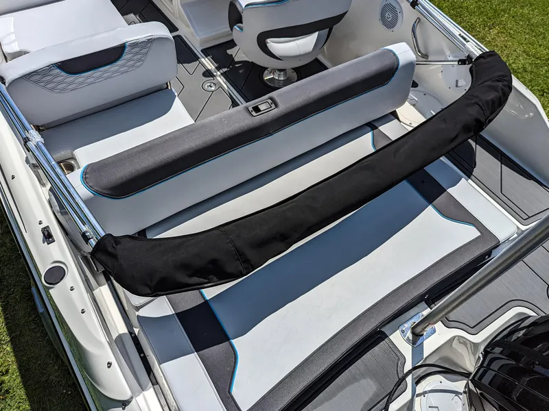 Slide: The Image of 2024 Bayliner Element M19 boat interior with seating and protective cover. - 16