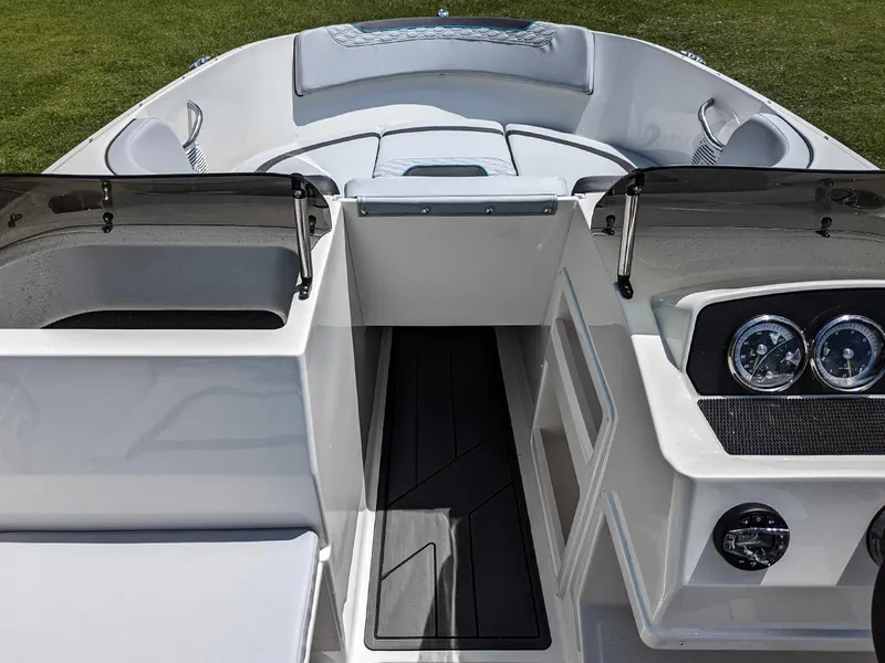 Slide: The Image of 2024 Bayliner Element M19 boat interior with seating and dashboard. - 19