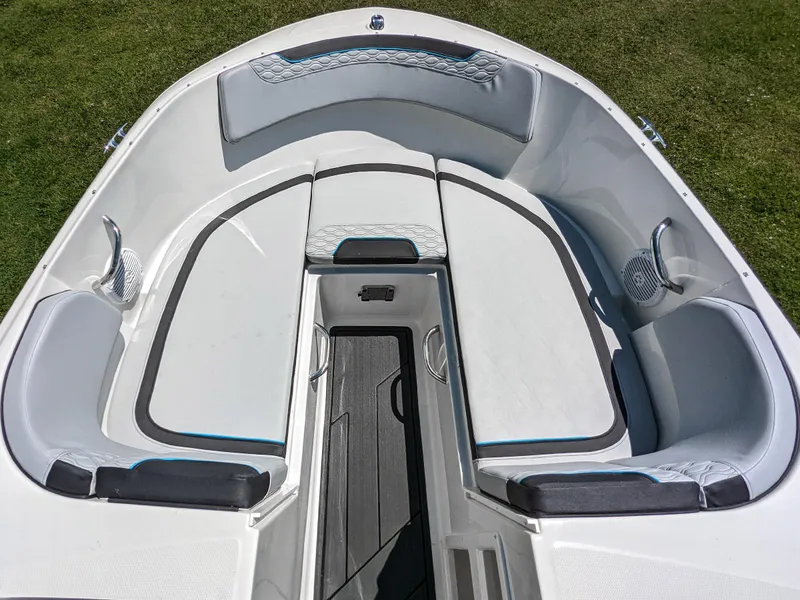 Slide: The Image of 2024 Bayliner Element M19 boat interior with cushioned seating and storage compartments. - 21