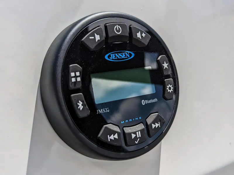 Slide: The Image of Jensen marine audio system on 2024 Bayliner Element M19 boat dashboard. - 23