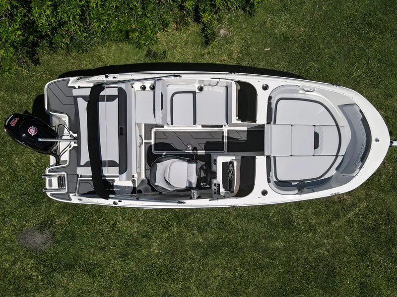 Slide: The Image of 2024 Bayliner Element M19 boat, aerial view, on grass, showcasing seating and layout. - 27