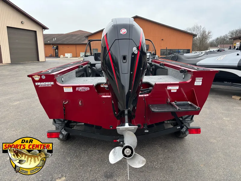 Slide: The Image of 2021 Tracker Targa V-19 WT Tournament Edition boat with outboard motor, parked outdoors. - 4