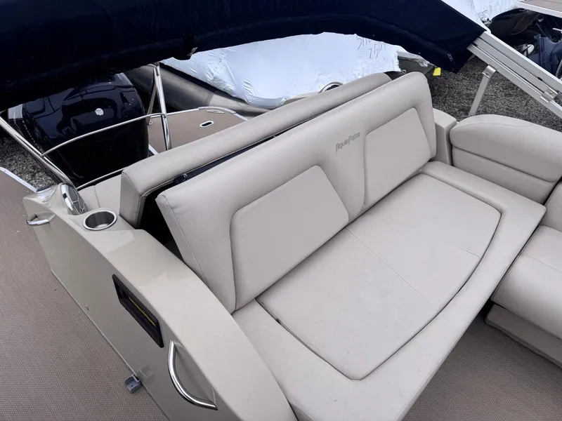 Slide: The Image of 2014 Godfrey AP240EL3 boat with beige seating and cup holder. - 11