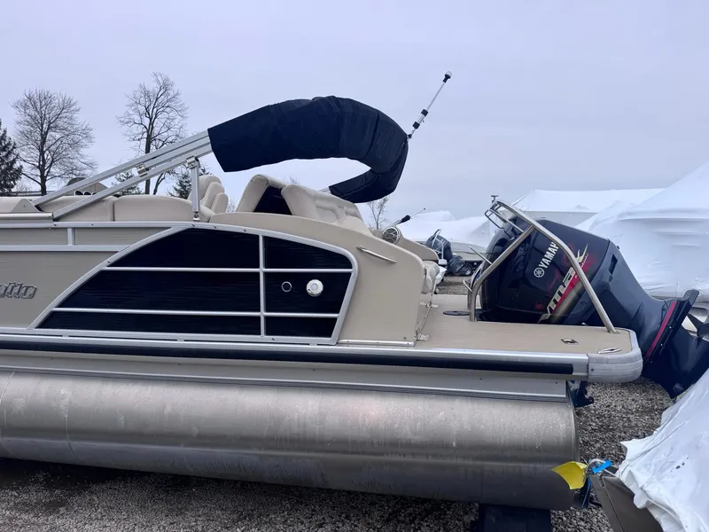 Slide: The Image of 2014 Godfrey AP240EL3 pontoon boat with Yamaha outboard motor, parked on gravel. - 3