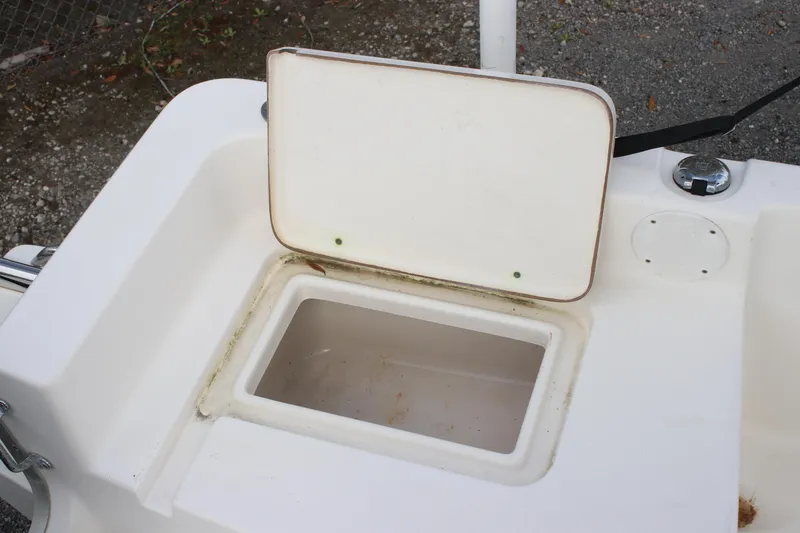 Slide: The Image of Open storage compartment on a 2015 Bulls Bay 2000 boat. - 12