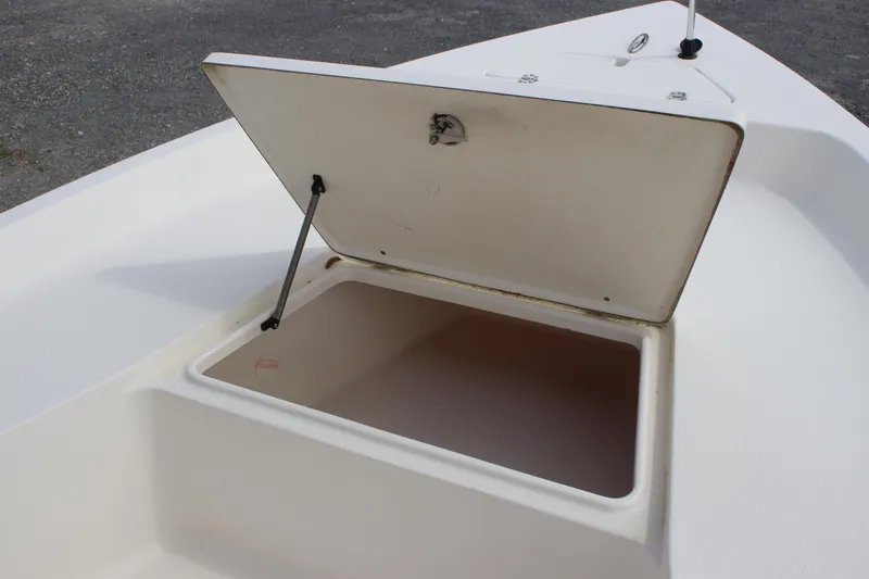 Slide: The Image of Open storage compartment on a 2015 Bulls Bay 2000 boat. - 13