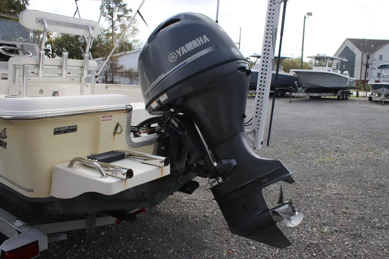 Slide: The Image of 2015 Bulls Bay 2000 boat with Yamaha outboard motor in a marina setting. - 15