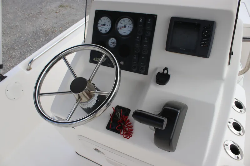 Slide: The Image of 2015 Bulls Bay 2000 boat console with steering wheel, gauges, and navigation system. - 9