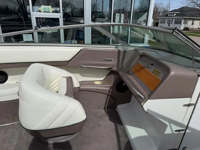 Slide: The Image of Interior of a 1995 Cobalt 252 boat with white and brown seating. - 12