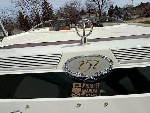 Slide: The Image of 1995 Cobalt 252 boat at Pistakee Marina with emblem and logo visible. - 19