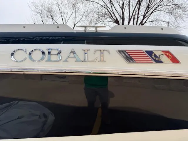 Slide: The Image of 1995 Cobalt 252 boat with logo and flags on the exterior. - 21