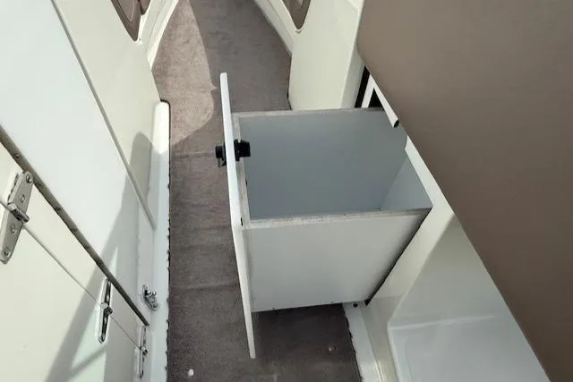 Slide: The Image of Open storage compartment on 1995 Cobalt 252 boat interior. - 24