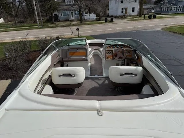 Slide: The Image of 1995 Cobalt 252 boat interior with white seating and dashboard view. - 5