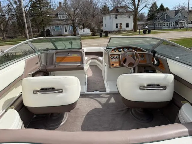 Slide: The Image of Interior of a 1995 Cobalt 252 boat with beige and white seating. - 6