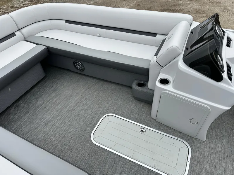 Slide: The Image of Interior of 2021 Godfrey Sweetwater 2486 SB pontoon boat with gray seating and flooring. - 24
