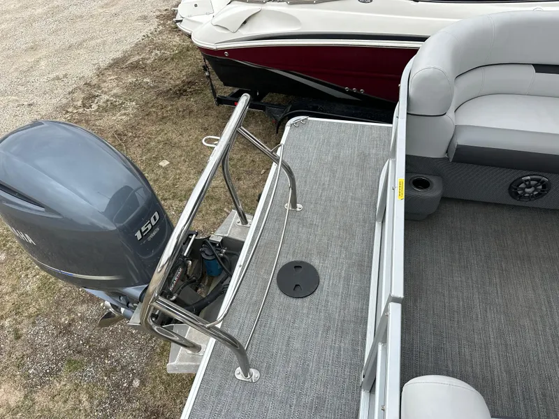 Slide: The Image of 2021 Godfrey Sweetwater 2486 SB pontoon boat with 150 HP engine, gray interior. - 26