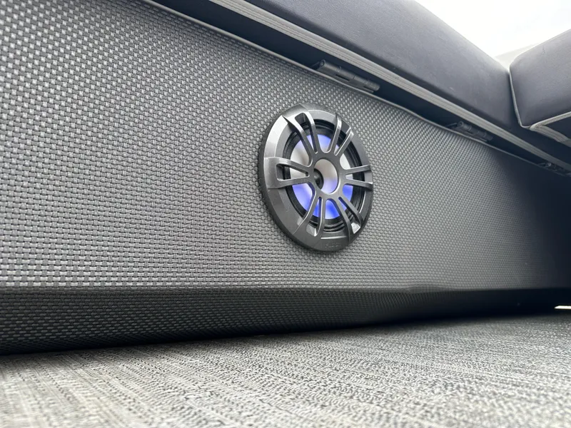 Slide: The Image of 2021 Godfrey Sweetwater 2486 SB boat interior with speaker and textured flooring. - 27