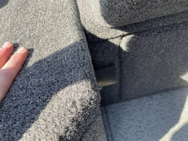 Slide: The Image of Close-up of 2025 Lund 2075 Pro-V Sport boat's gray carpeted interior detail. - 15