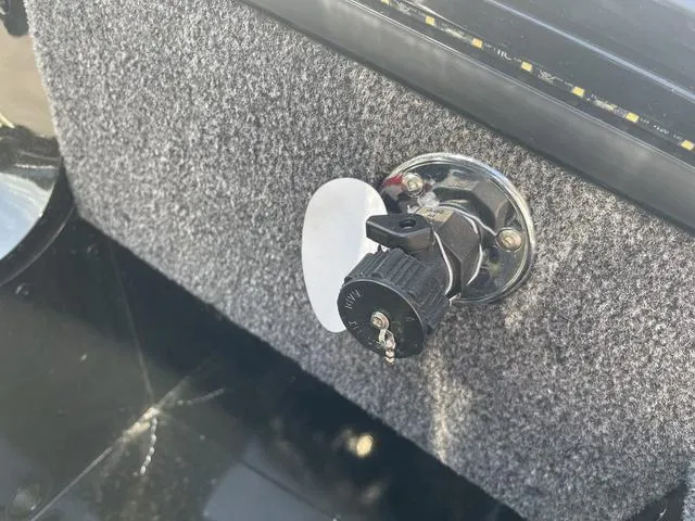 Slide: The Image of Ignition switch on 2025 Lund 2075 Pro-V Sport boat dashboard. - 33