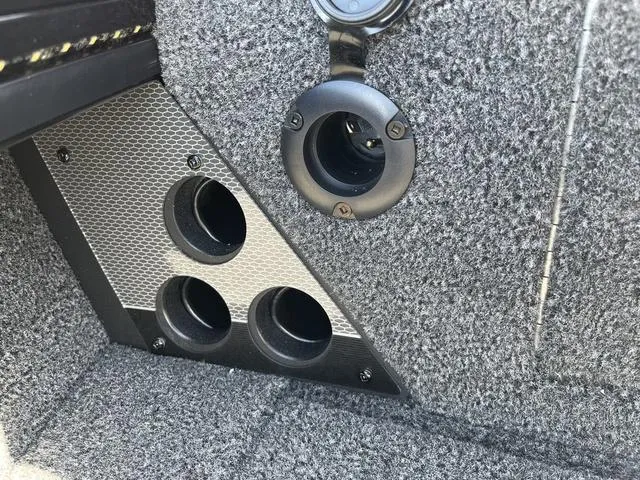 Slide: The Image of Interior detail of 2025 Lund 2075 Pro-V Sport boat with carpeted finish and cup holders. - 41