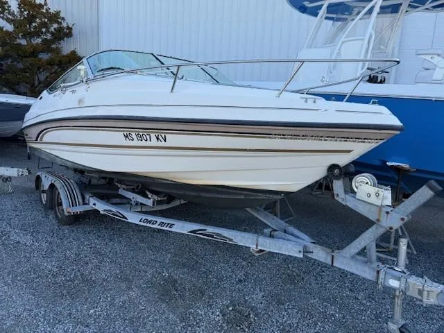 Slide: The Image of 1999 Chaparral 2135 SS boat on trailer, parked outdoors. - 0