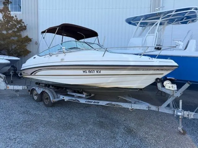 Slide: The Image of 1999 Chaparral 2135 SS boat on trailer, parked outdoors. - 1