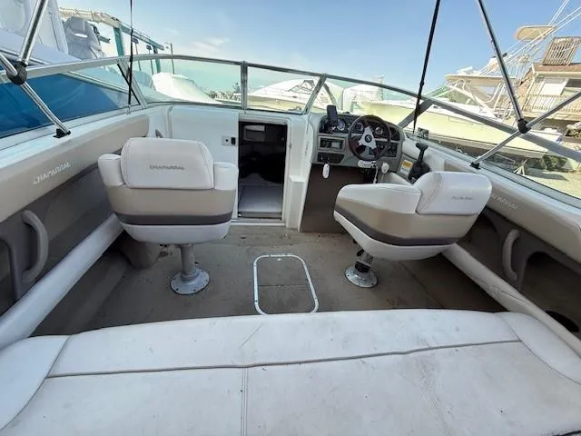 Slide: The Image of 1999 Chaparral 2135 SS boat interior with seating and steering wheel. - 10
