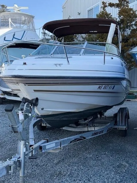 Slide: The Image of 1999 Chaparral 2135 SS boat on trailer, parked outdoors. - 3