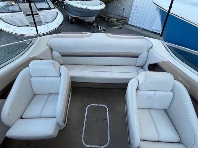 Slide: The Image of 1999 Chaparral 2135 SS boat interior with white seating and spacious layout. - 8