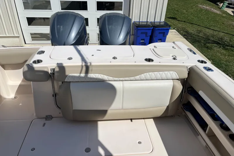 Slide: The Image of 2013 Grady-White Freedom 307 boat with dual engines and spacious seating area. - 16