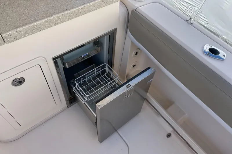 Slide: The Image of 2013 Grady-White Freedom 307 boat with open built-in storage compartment. - 23