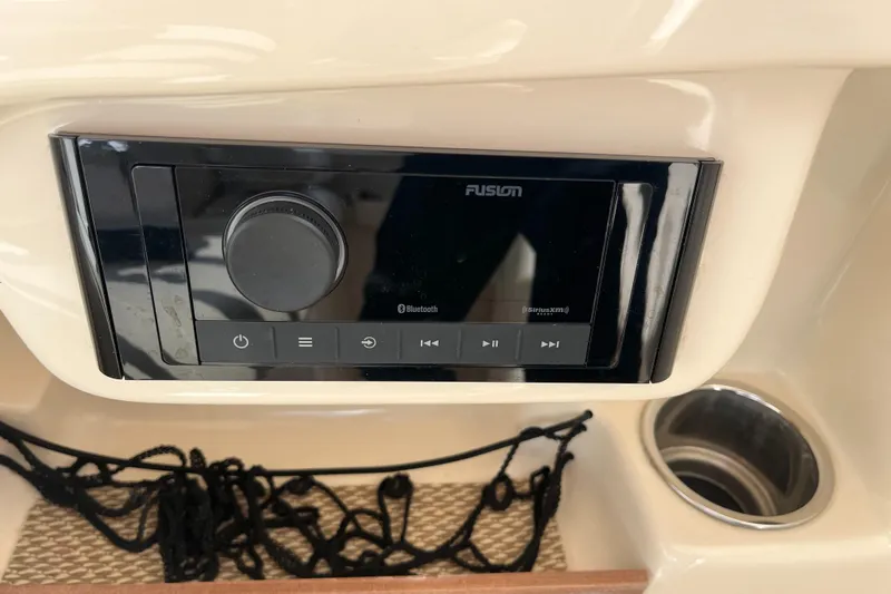Slide: The Image of Fusion stereo system on 2013 Grady-White Freedom 307 boat dashboard. - 26