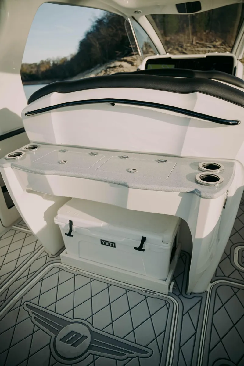 Slide: The Image of 2021 Deep Impact 399 Sport boat interior with seating and storage. - 12