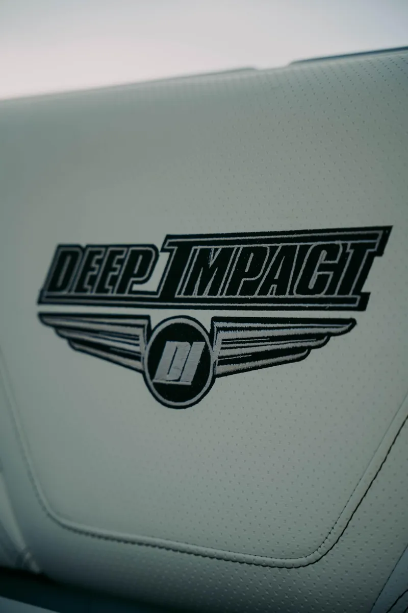 Slide: The Image of Deep Impact 399 Sport 2021 logo on white leather upholstery. - 15