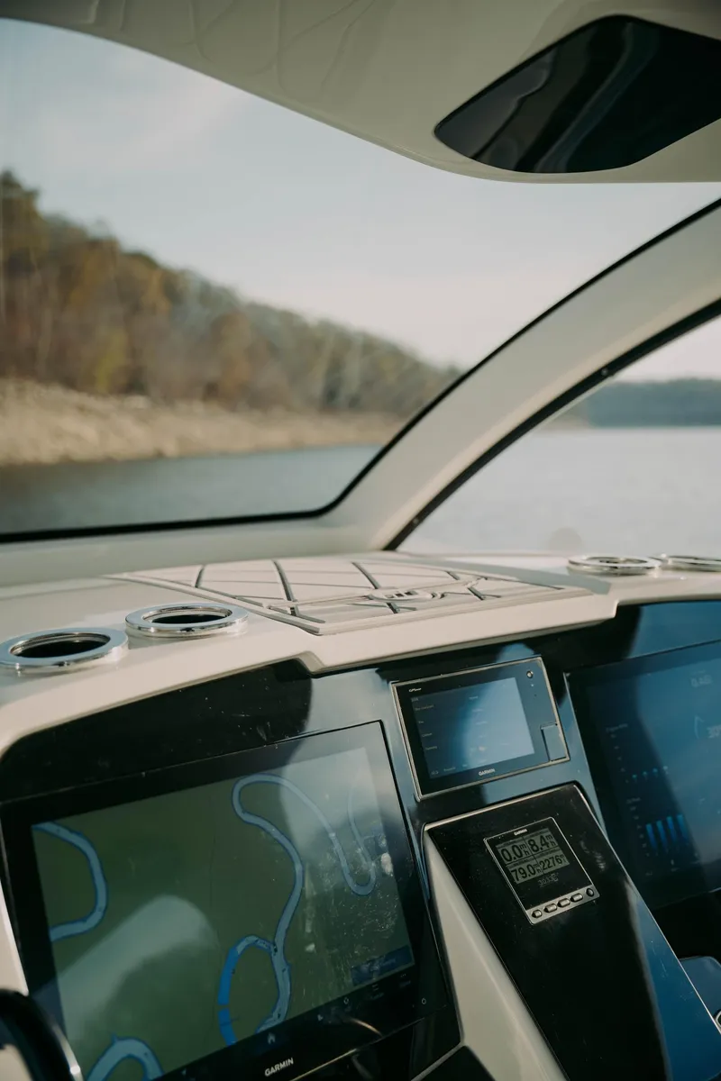 Slide: The Image of Interior view of 2021 Deep Impact 399 Sport boat with navigation screens. - 5