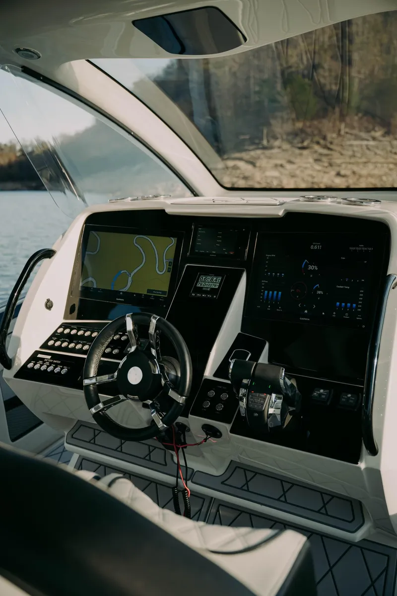 Slide: The Image of Cockpit of 2021 Deep Impact 399 Sport boat with advanced navigation system. - 6