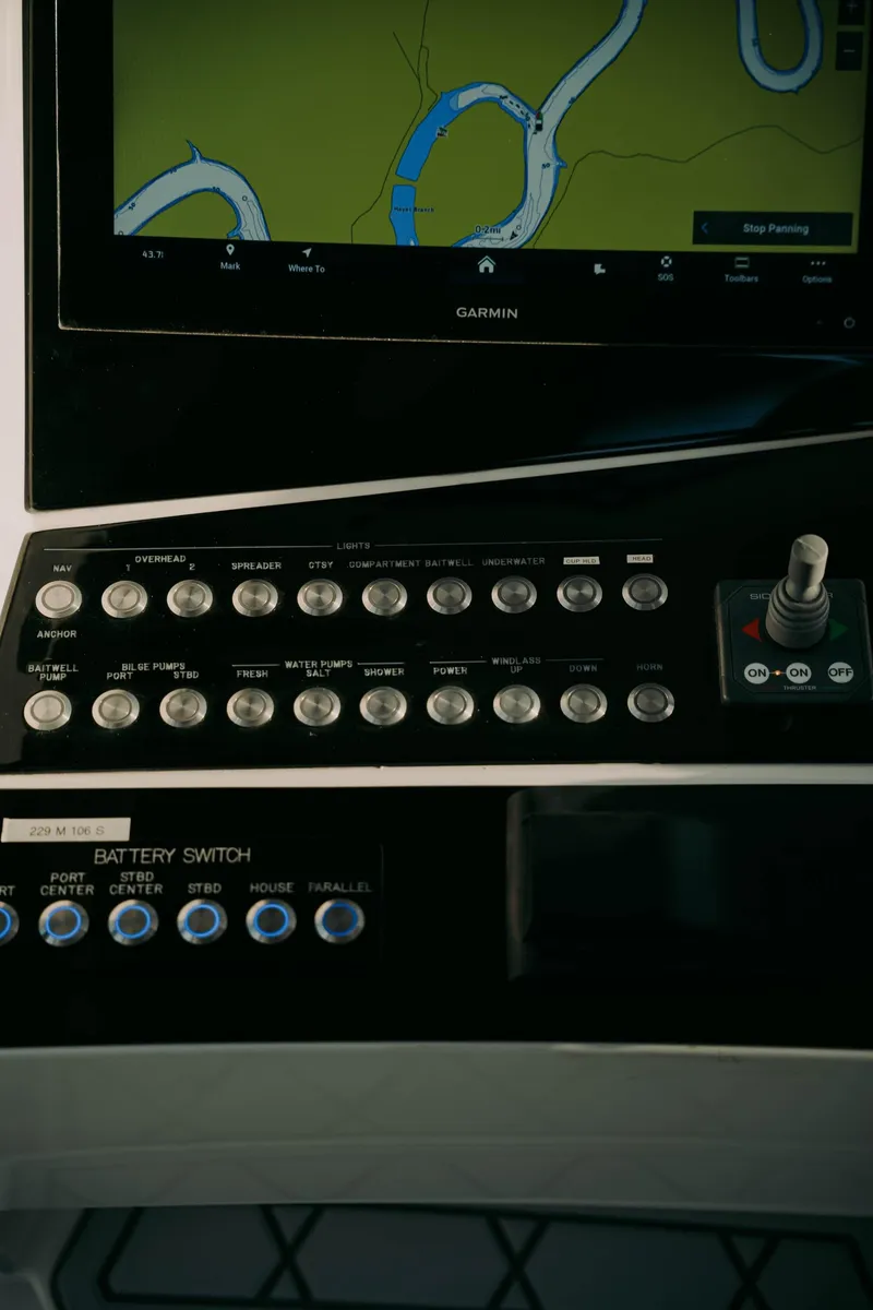 Slide: The Image of Control panel of a 2021 Deep Impact 399 Sport boat with navigation display. - 7
