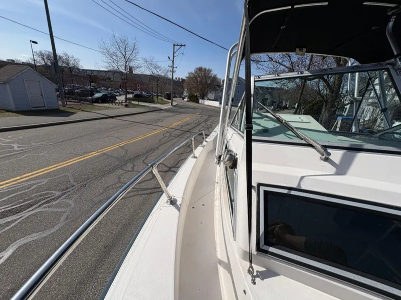 Slide: The Image of 1988 Grady-White 22 Seafarer boat parked on a street, side view. - 15