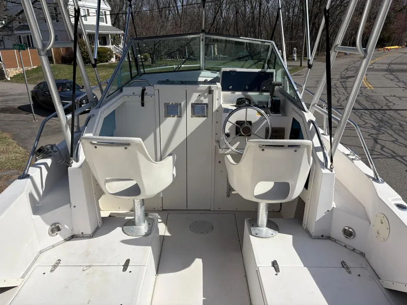 Slide: The Image of 1988 Grady-White 22 Seafarer boat interior with dual seats and steering wheel. - 8