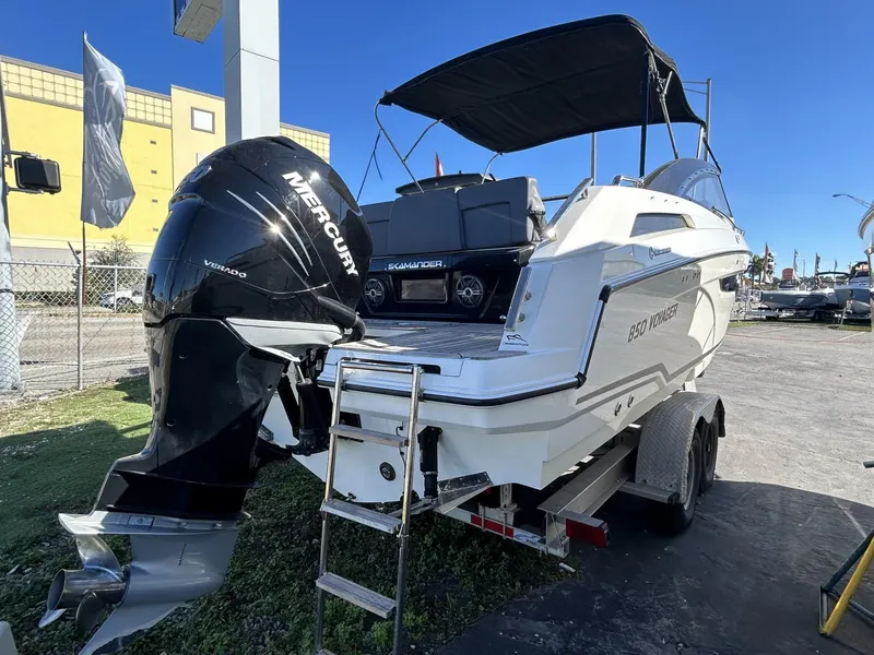 Slide: The Image of 2022 Parker Poland 850 Voyager boat on trailer with Mercury outboard engine. - 13