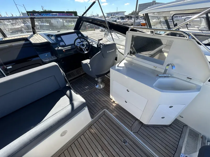 Slide: The Image of Interior of 2022 Parker Poland 850 Voyager boat with seating and helm. - 16