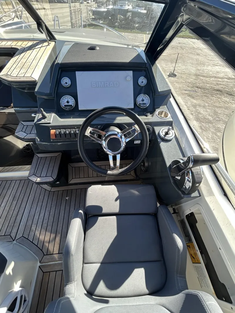 Slide: The Image of Cockpit of 2022 Parker Poland 850 Voyager boat with modern steering and controls. - 17