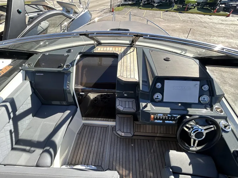 Slide: The Image of 2022 Parker Poland 850 Voyager boat cockpit with modern controls and seating. - 18