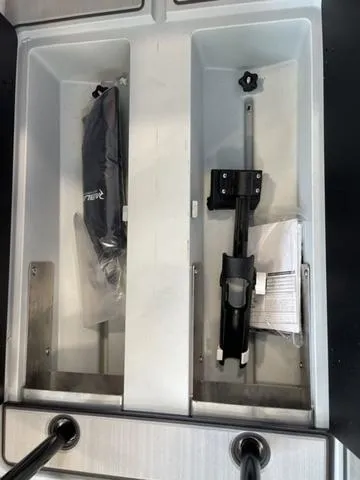 Slide: The Image of Storage compartments in a Veer V13 vehicle, showcasing organized equipment and accessories, 2023 model. - 10