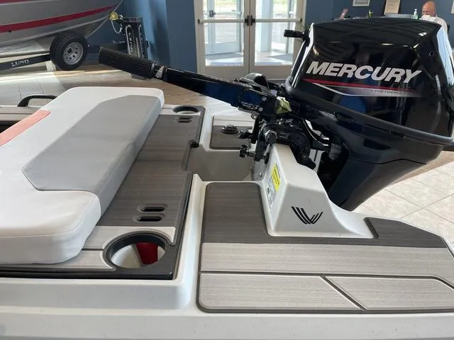 Slide: The Image of Boat with Mercury outboard motor, Veer V13 model, 2023, featuring cushioned seating and modern design. - 11